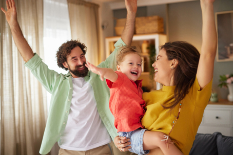 parents playing with their son